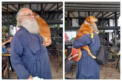 Λέσβος: Ιερέας κουβαλάει στα χέρια μια σκυλίτσα που έχει πρόβλημα με τη μέση της! (pics)